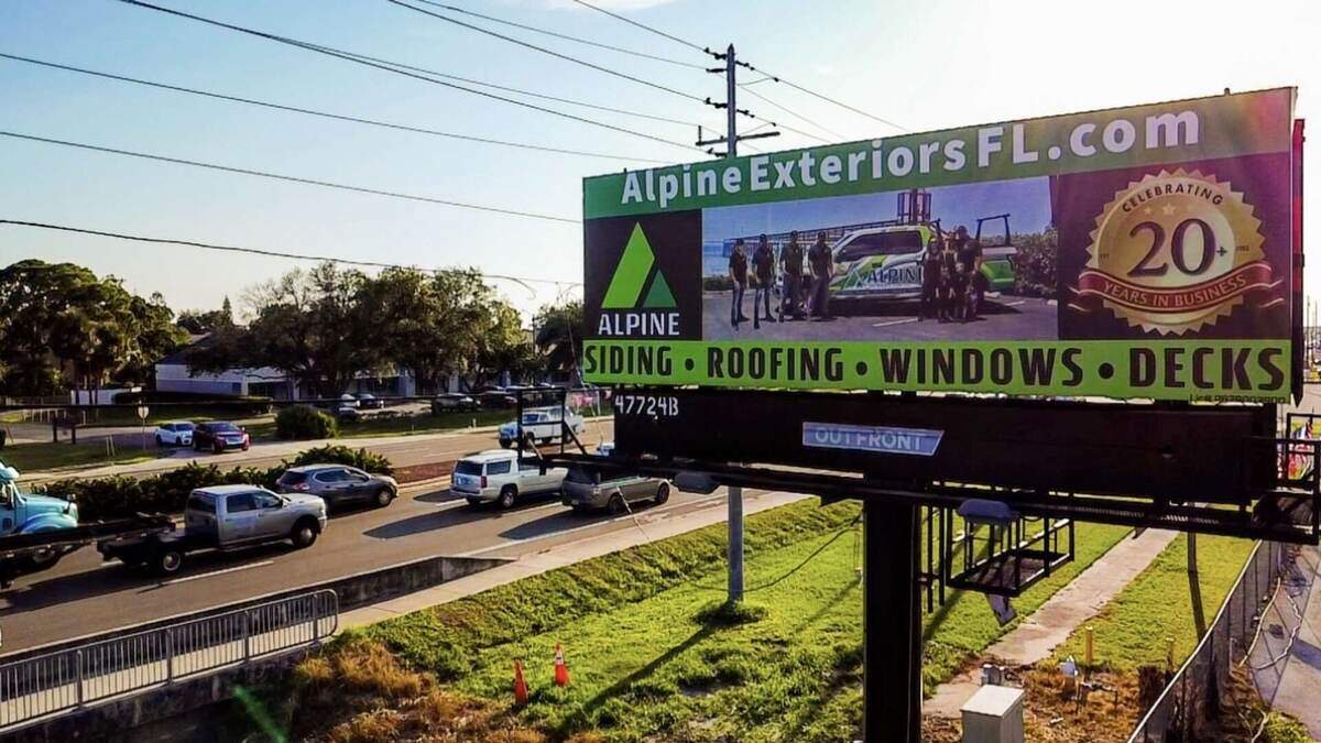 Alpine Exteriors Florida Billboard - Serving Tampa Area with Premium Siding, Roofing, Windows & Decks featuring 20 years celebration and AlpineExteriorsFL.com